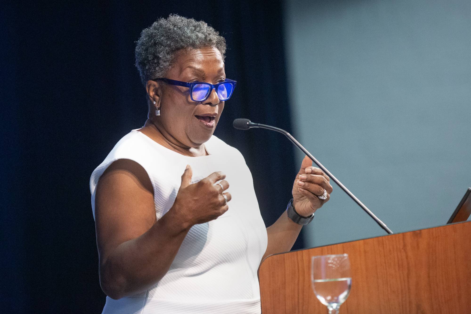 person speaking at a podium